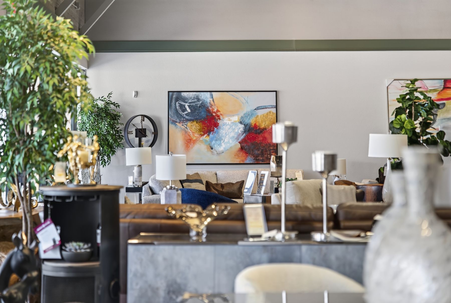 Close detail of artwork, lamps and glassware on a showroom display